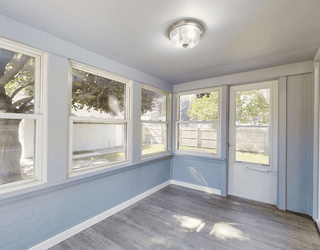 Contractor leveling and installing replacement window in Dane County WI residence