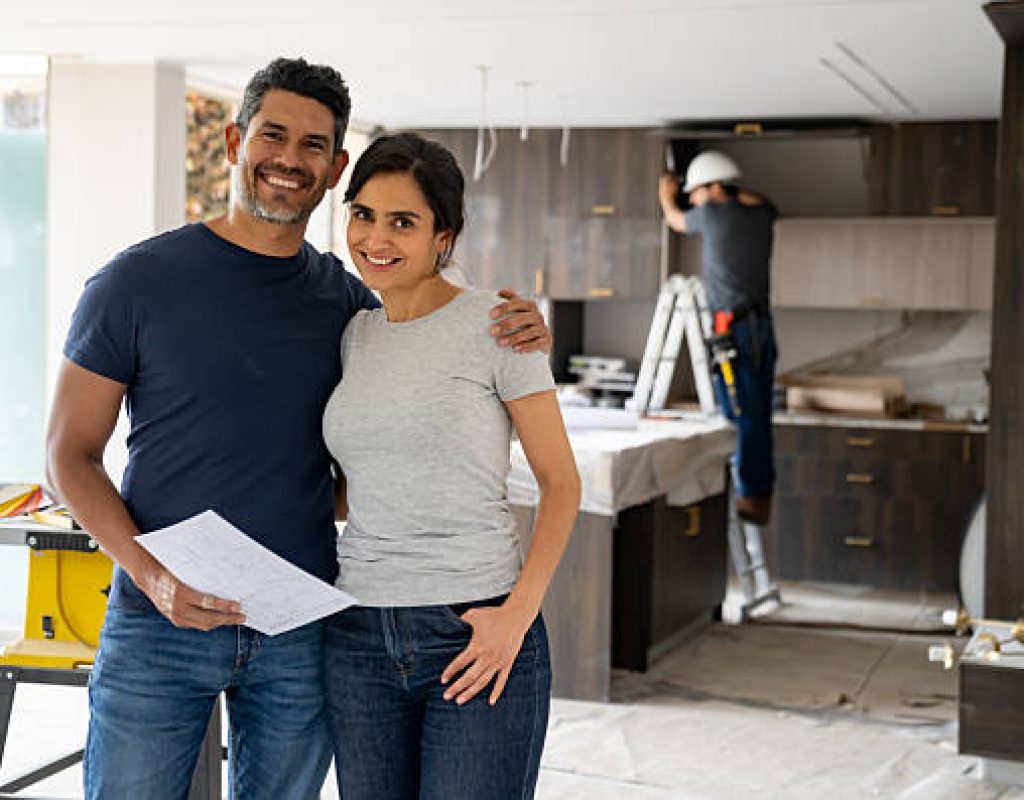 Remodeling professional installing custom kitchen cabinetry in a Madison, WI home