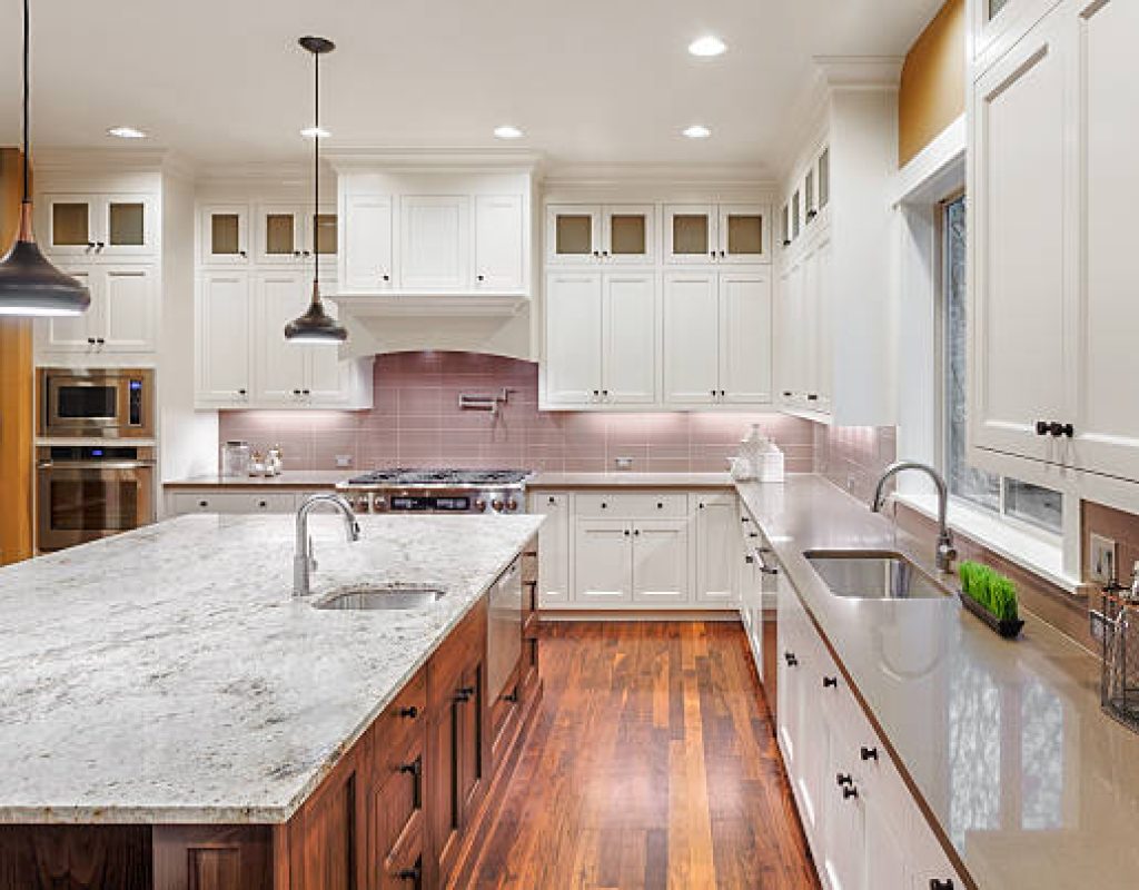 HLW BUILDERS, LLC installing high end countertops and kitchen fixtures in renovation