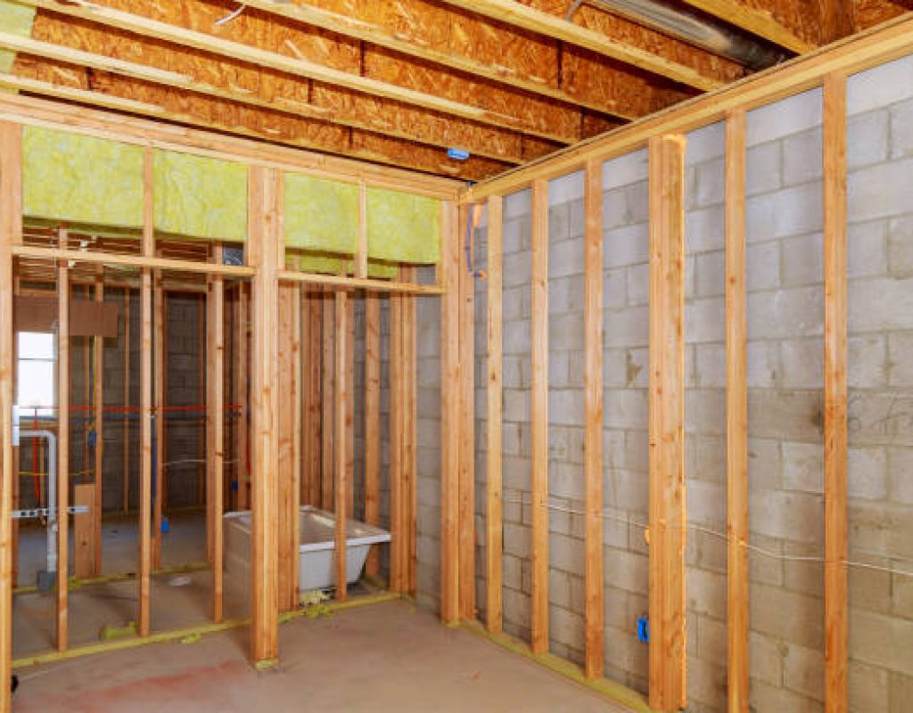 Contractor installing drywall in Sun Prairie basement renovation